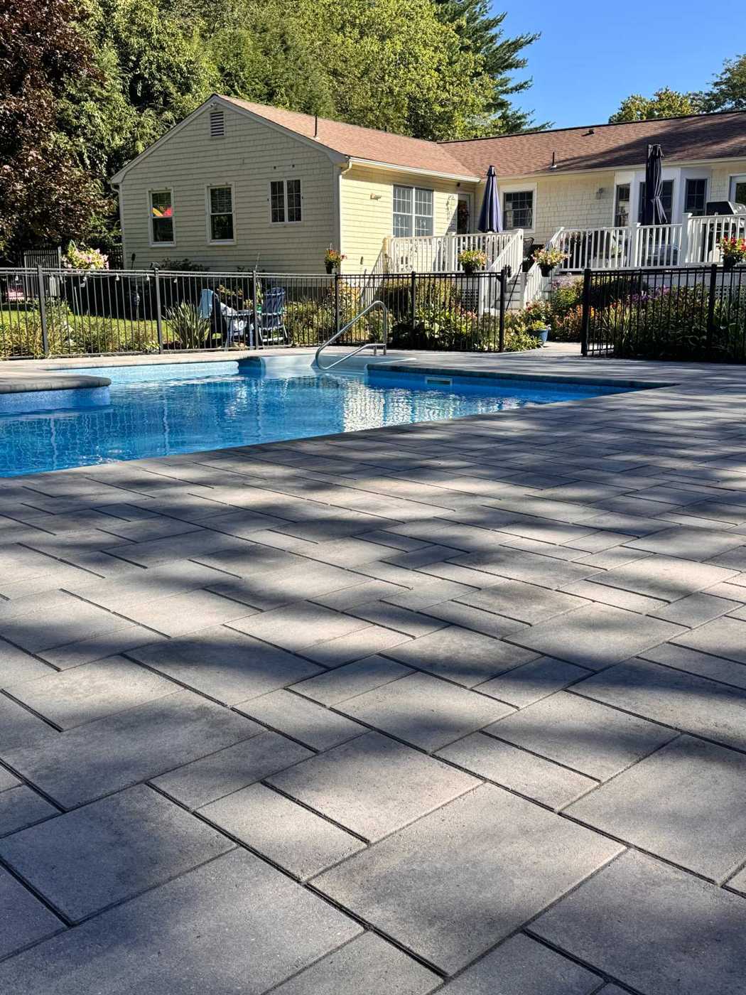Gray paver pool deck washed, sanded and sealed at a Rhode Island home
